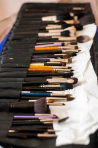 makeup brushes and pencils, highlighters